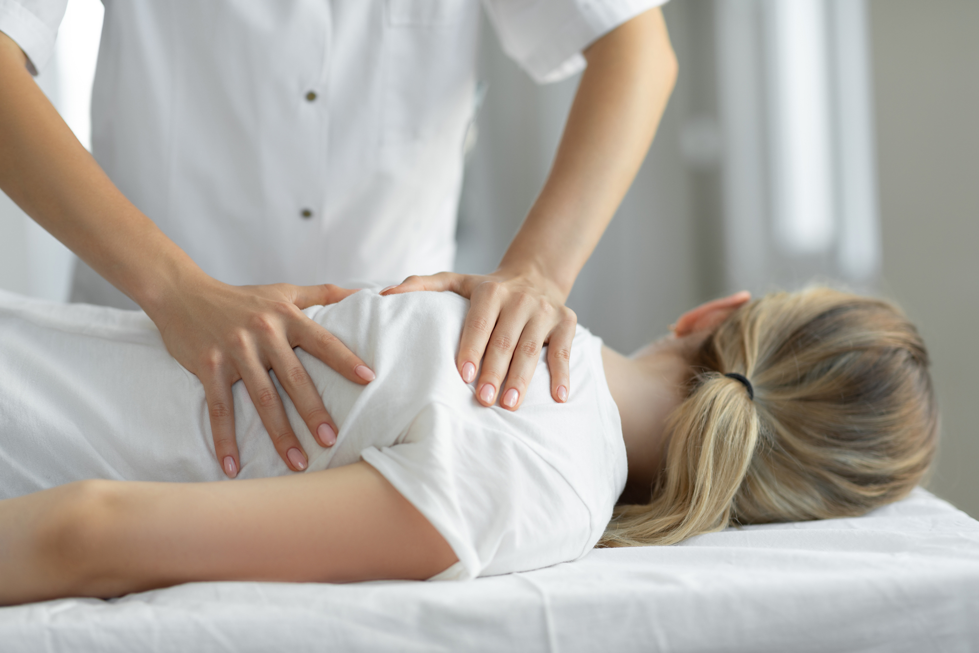Female receiving osteopathy treatment